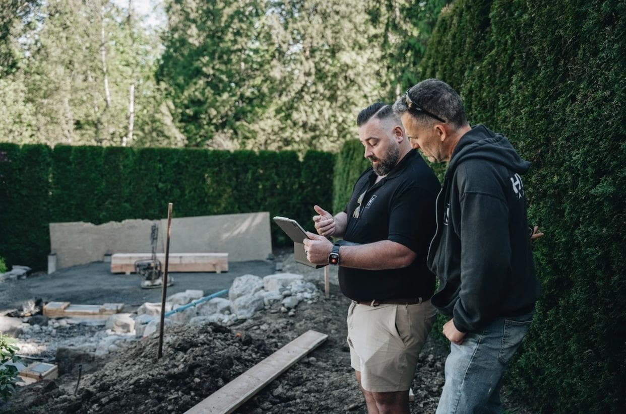 Jason talking through landscape design on iPad on-site