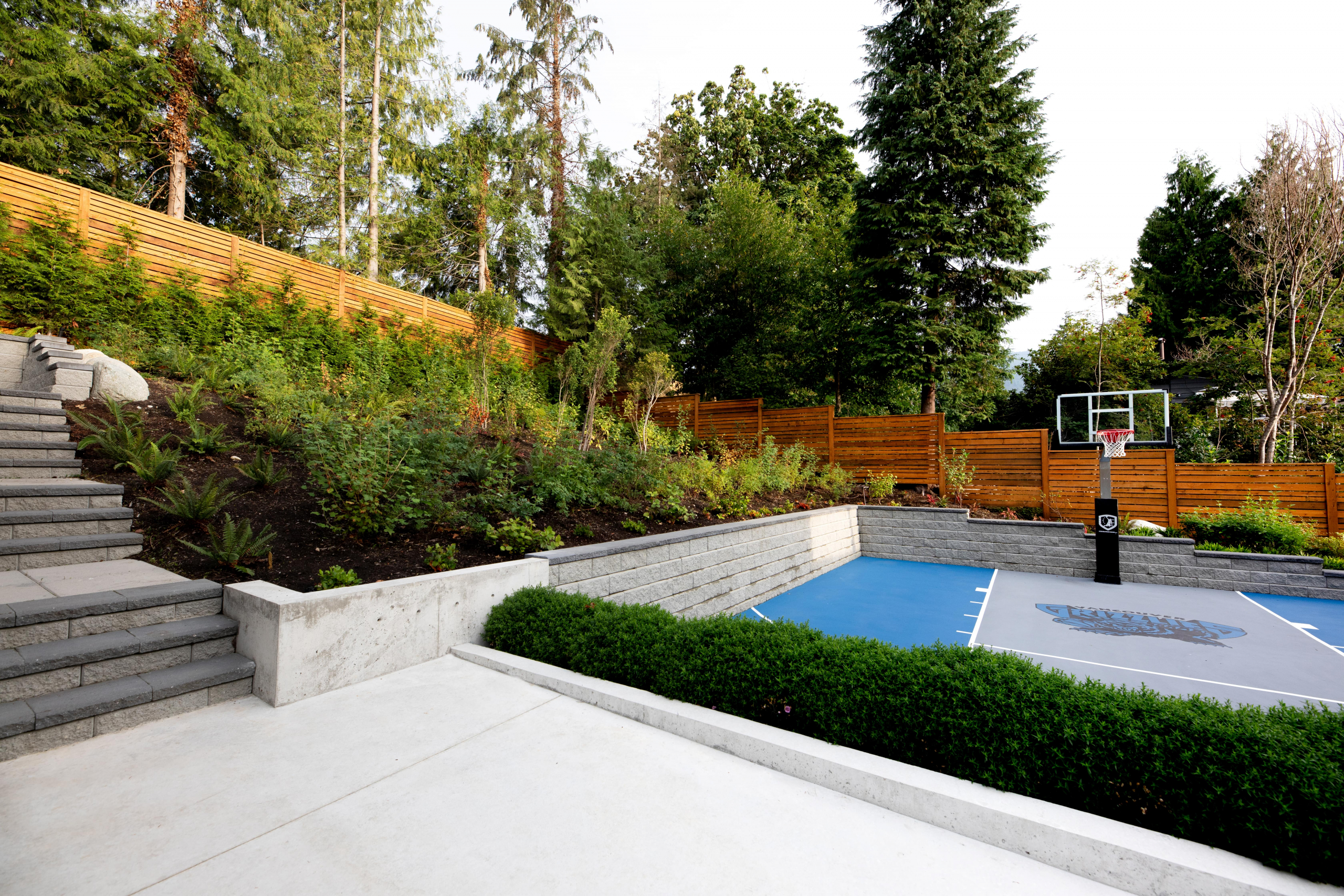 A custom outdoor space with a basketball court.